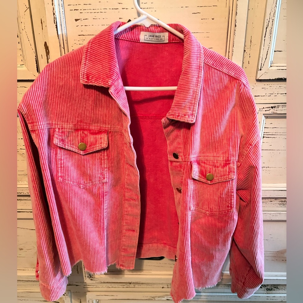 Jane Rice vintage-washed pink corduroy jacket with a raw, distressed hem